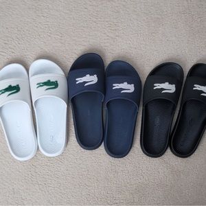 Lacoste slides in white, black and blue